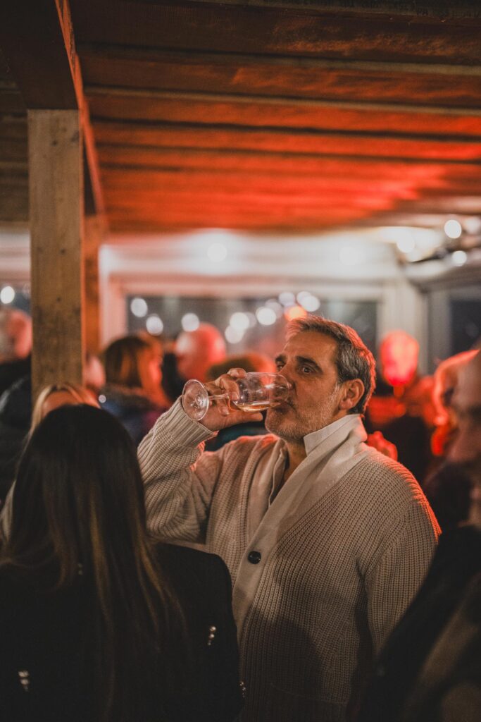 People drinking at beach house falmouth launch